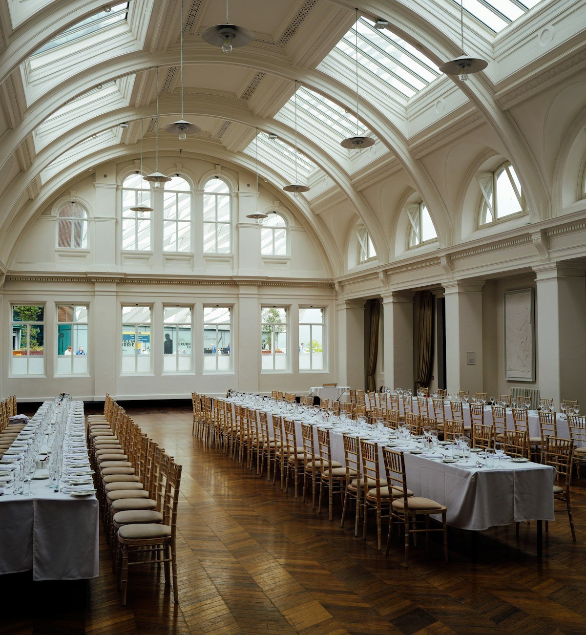 Grand hall with long tables set for a banquet