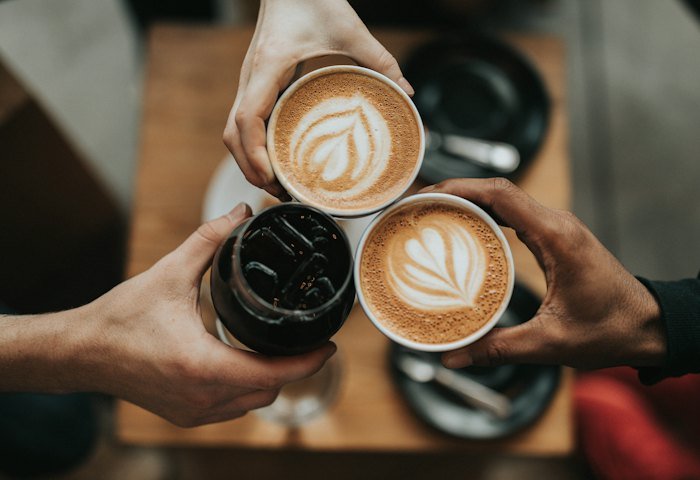 Two cups of latte with leaf art