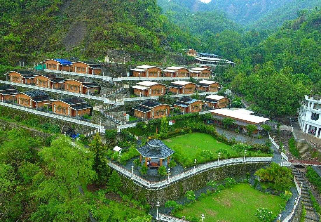 Cottages terraced into a green mountainside