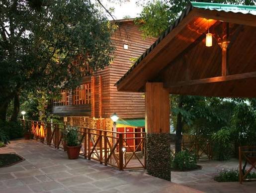 The resort's restaurant building lit up in the evening