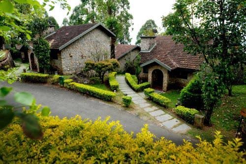 Stone cottages along a garden pathway