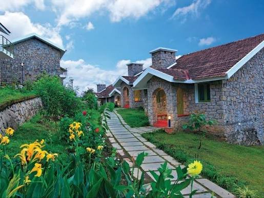 Row of family stone cottages along a garden path