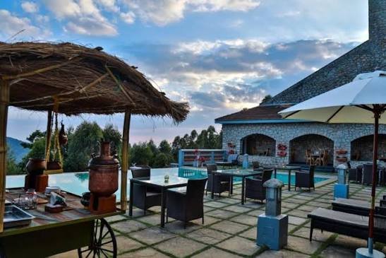 Poolside coffee and beverage station under a thatched roof