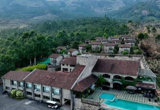 Aerial view of the resort nestled in the forested hills
