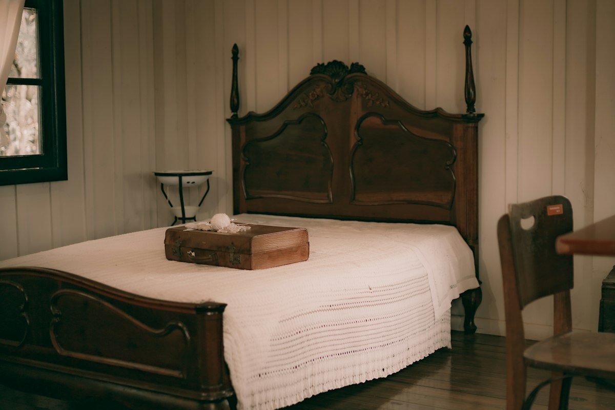 Bedroom with a carved wooden bed