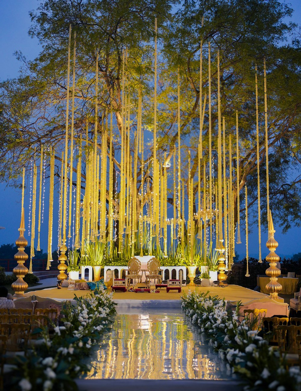 Evening ceremony stage lit among the trees